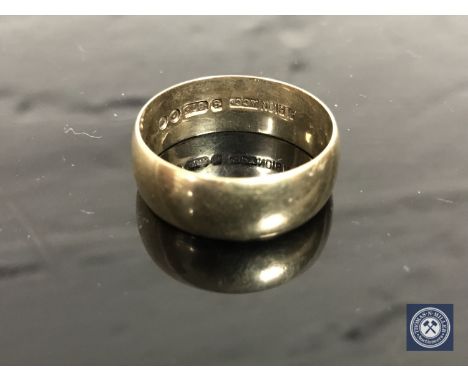 A 9ct gold band ring, size V/W CONDITION REPORT: 6.0g