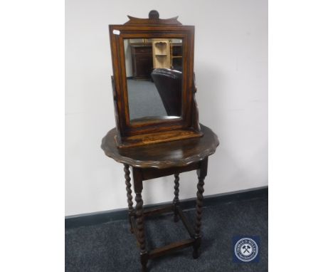 A shaped oak barley twist occasional table together with an Edwardian mirror with shelf