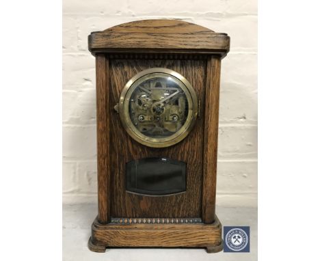 A mahogany mantel clock with silvered dial together with an oak bracket clock (parts missing)