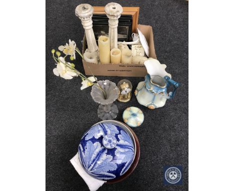 A box containing framed pictures, wooden candlesticks, clock under shade, ornaments, miscellaneous china, together with a was