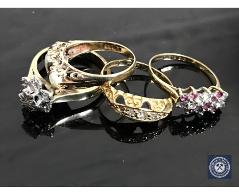 A 9ct gold diamond cluster ring, an opal and garnet ring, a ruby and diamond ring and an 18ct gold ring (4)