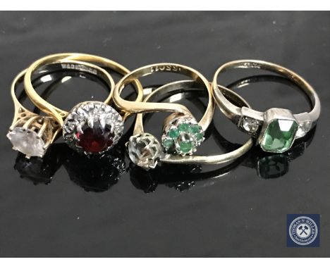 A 9ct gold garnet cluster ring, an emerald ring and three other rings (5)