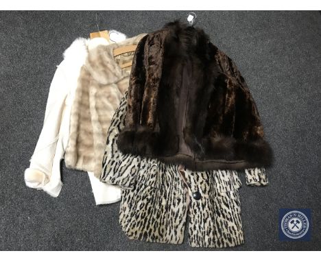 A fur coat together with two simulated fur coats and a sheepskin jacket