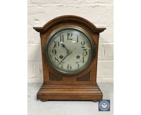 A mahogany cased bracket clock with silvered dial, with pendulum