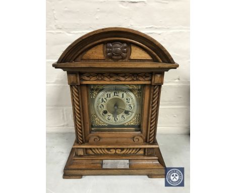 A mahogany cased Junghans presentation bracket clock with brass dial, with pendulum