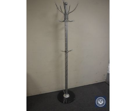 A hat and coat stand on a marble base 