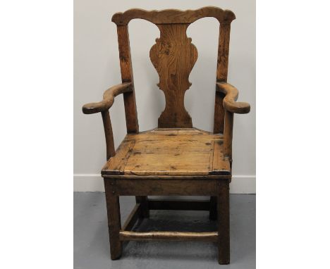 18TH CENTURY PRIMITIVE OAK CHIPPENDALE STYLE COMMODE ARMCHAIR having arch cresting above vase shaped splat with open arms, li