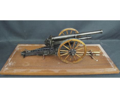 A WELL MADE SCALE MODEL OF A BREECH LOADING FIELD CANNON on wooden steel rimmed artillery wheels, working breach action, toge