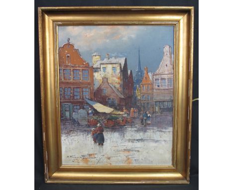 H. WAGNER, (Dutch, first half 20th Century), winter scene, a Dutch market square with figures under grey skies, signed, oils 
