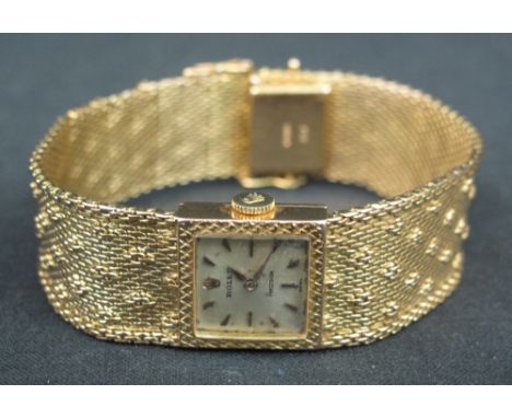 18CT GOLD ROLEX LADY'S BRACELET WRISTWATCH, having square satin face with Rolex crown, marked: Rolex Precision, with arrowhea