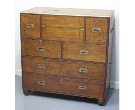 19TH CENTURY BRASS BOUND, TWO SECTION, TEAK SECRETAIRE CAMPAIGN CHEST OF DRAWERS, having fold out centre section revealing to