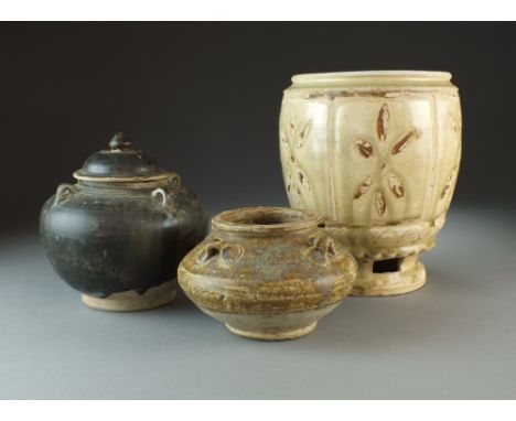 Three Chinese pottery vessels, Han to Tang Dynasty, the first of compressed ovoid shape with four loops to the shoulder and c