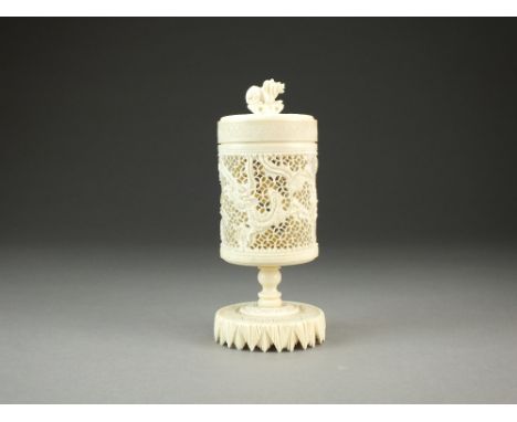 A Chinese Canton carved ivory stem cup and cover, of cylindrical form and worked with wrythen dragons on a reticulated ground