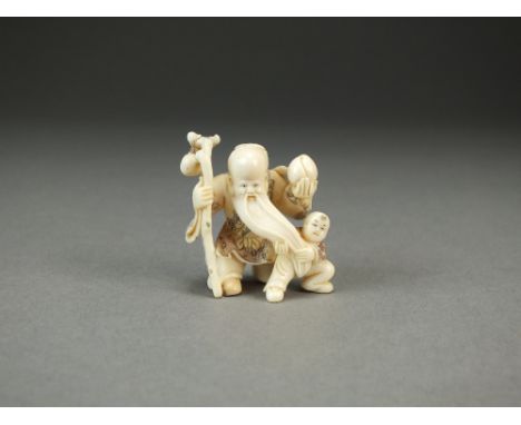 A Japanese ivory netsuke of Shou Lao, modelled standing and holding a peach and a staff with gourd, accompanied by a boy, 3.5