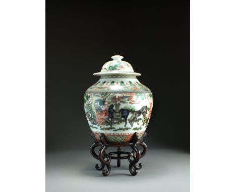 A Chinese famille verte vase and cover, Kangxi, of ovoid form, the domed cover with button finial, painted in colours with th