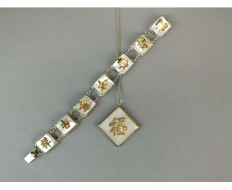 A Chinese silver and gilt pendant and bracelet set, Hong Kong, Republic period, the pendant of lozenge form inset with mother