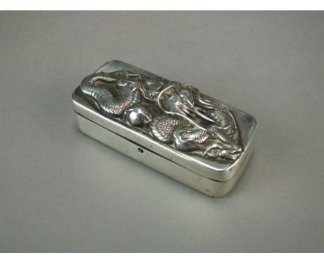 A Chinese silver snuff box, late 19th Century, of rectangular form with rounded corners, the hinged top chased in high relief