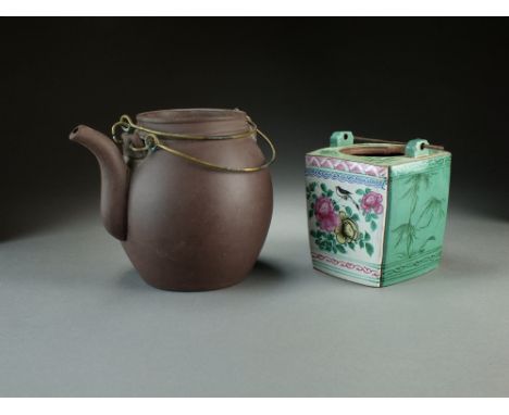A Chinese Yixing teapot, 20th Century, of ovoid form with double wire handle, 15cm high, and an enamelled Yixing tea caddy of