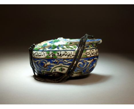 A glazed earthenware kashkul, Persia, 19th Century, of ovoid form with lobed rim, moulded and painted in colours with figures