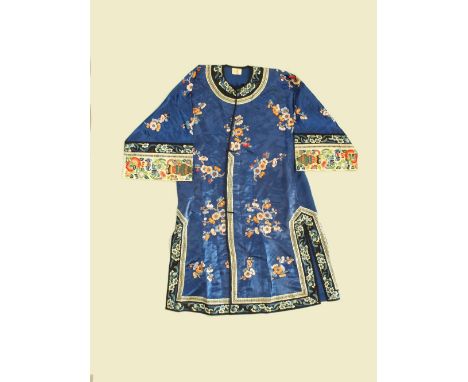 Two Chinese silk informal robes, late Qing/Republic period, the first woven with scattered prunus blossom on a dark blue grou