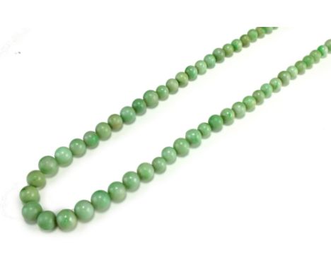 A graduated jade bead necklace, comprising 102 near uniform spherical beads and slightly varying pale green colour, approxima