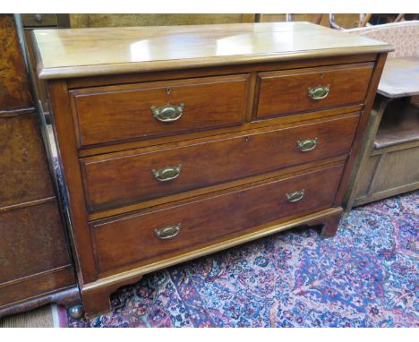 An Edwardian walnut chest of drawers, with two short and two long graduated drawers on bracket feet, 107 cm wide, 43.5 cm dee