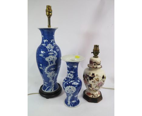 A Chinese prunus design baluster vase, 25.5 cm high, a similar vase form table lamp and a Masons style table lamp (3) 