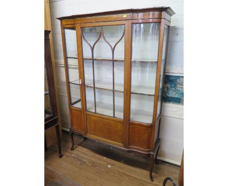 An Edwardian chequerbanded mahogany display cabinet, with central ogee glazed and panellled door flanked by shaped glazed pan