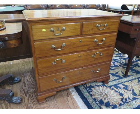 A George III mahogany chest of drawers, with two short and three long graduated drawers on ogee bracket feet, 88 cm wide, 52 