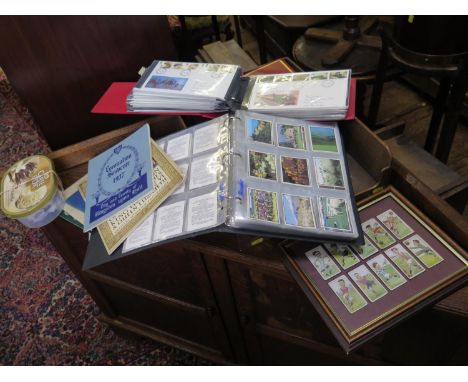 Three albums of First Day Covers, an album of trade cards, Royal memorabilia, and loose stamps 