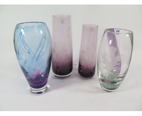 A Caithness Glass vase etched with bluebells, 20 cm high, another with a spray of flowers, 23 cm high and two other Caithness