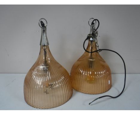 A set of four glass pendant light fittings