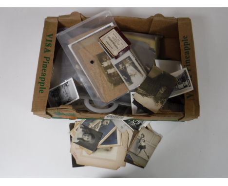 A large box containing monochrome photographs, vintage cards monochrome images, etc 
