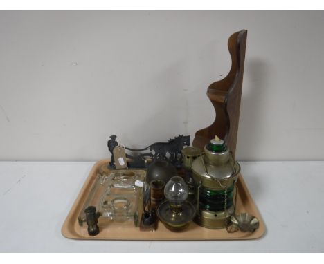 A tray of brass ornaments, miniature miners lamp, a metal ornament of a farmer, wooden stand, etc 