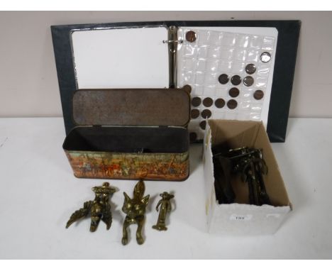A box of vintage brass door knockers, commemorative medal, coin, tin, folder of coins  