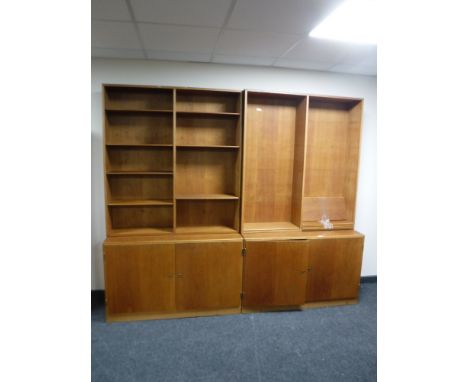 A mid twentieth century light oak two section office bookcase, with fitted cupboards below 