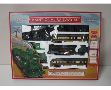 A Tradition railway set, battery powered, comprising of locomotive engine, carriages, track etc 