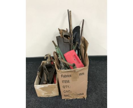 Two boxes containing vintage saws and wood working planes etc