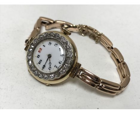 A lady's vintage 18ct gold diamond set cocktail watch on 9ct gold bracelet
