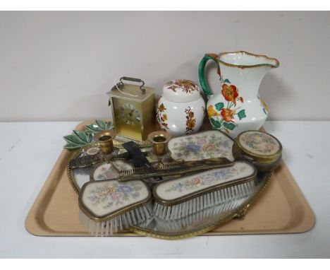 A tray of needlepoint dressing table set, carriage clock, Maling jug, etc 