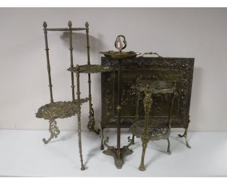 Two brass tiered stands together with a brass ashtray on stand and a brass firescreen
