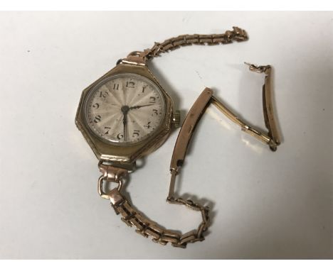 A vintage lady's wristwatch by Rolex, cased numbered 43392 15 Jewels.