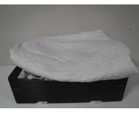 A box of vintage quilts etc