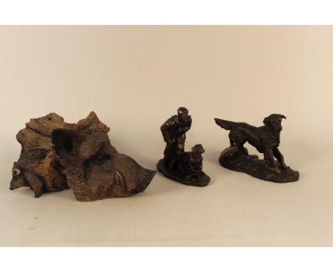 An interesting cast resin boars head resembling carved wood, with a small boar on the side and one behind, approx 14" long to