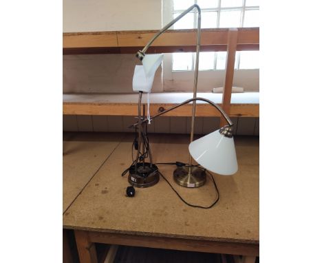 A handy flexible light unit with adjustable magnifying glass and flexible holding cup together with a brass finish small lamp