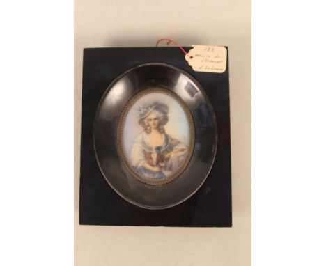 In the manner of Elizabeth Vigee Lebrun, a framed hand painted portrait miniature of an 18th Century French lady, attached ti