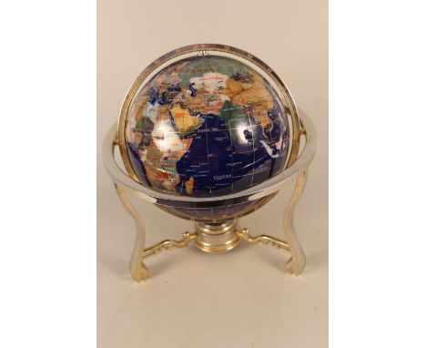 An Oriental stone set globe on stand with integral compass, 12 12/" high