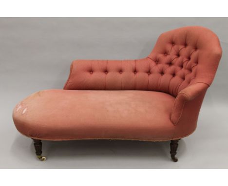 A Victorian pink button upholstered chaise lounge. Approximately 150 cm long.