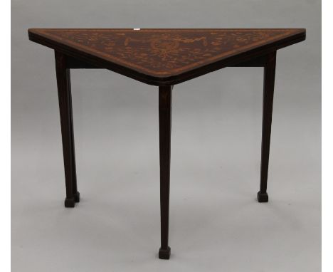 A 19th century Dutch marquetry inlaid folding card table. 107 cm long.