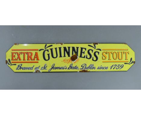 An enamel Guinness sign. 57 cm long.